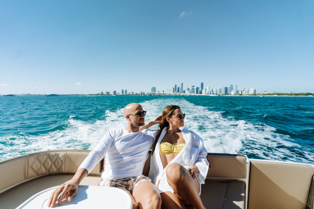 Show a couple enjoying the experience of a private yacht in Miami